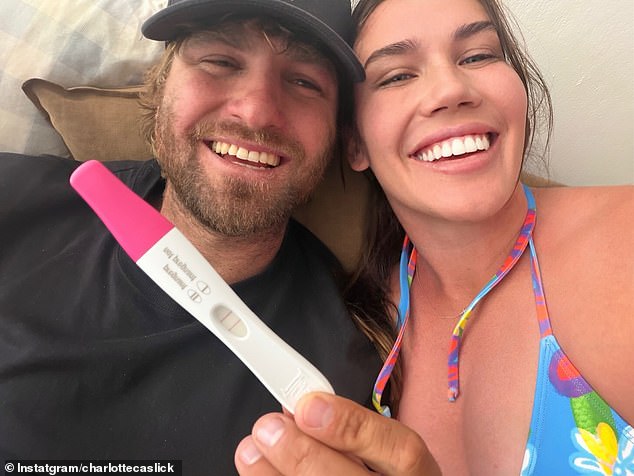 Pictured: Charlotte Caslick And Lewis Holland Show Off Her Positive Pregnancy Test In The Photo They Used To Announce Their Baby Joy On Social Media