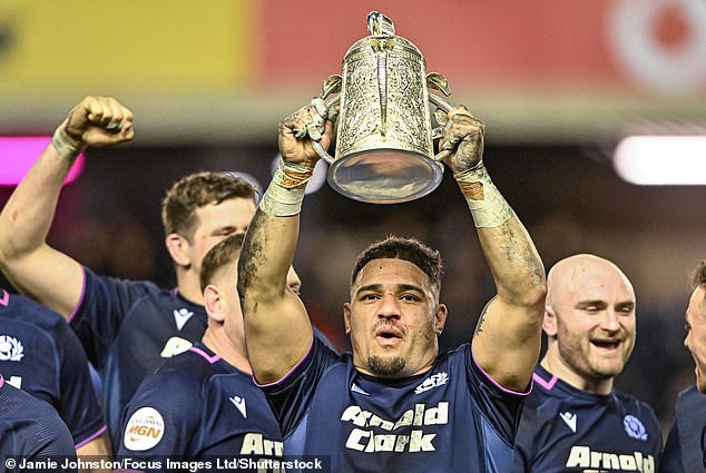 Tuipulotu Holds Calcutta Cup Aloft After Last Weekend's Triumph Over England At Murrayfield