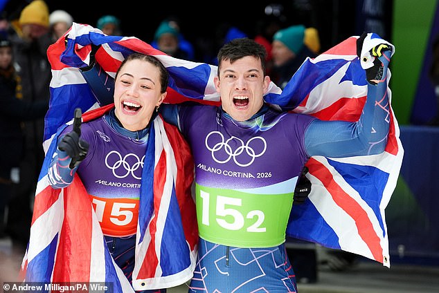 Great Britain's Matt Weston And Tabitha Stoecker Celebrate Winning Gold After The Skeleton Mixed Team Final On Day Nine Of The Milano Cortina 2026 Winter Olympics. Their Stunning Victory By 0.17 Seconds Sparked Wild Scenes Among Fans At The Cortina Sliding Centre