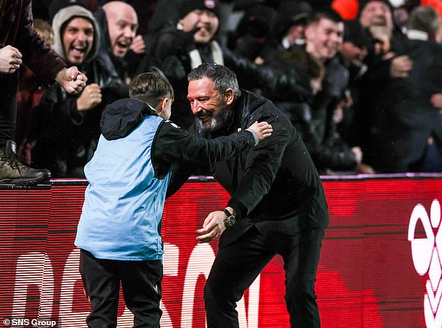 Mcinnes Celebrated Tuesday's Dramatic Edinburgh Derby Winner With A Delighted Ball Boy