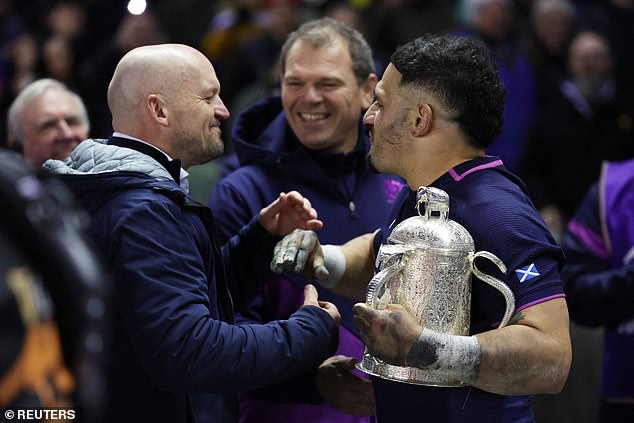 Gregor Townsend (Left) And Skipper Sione Tuipulotu Embrace With The Calcutta Cup