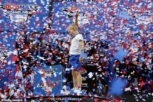 Beau Reddick, The Son Of Tyler Reddick, Celebrates On His Fathers Car In Victory Lane
