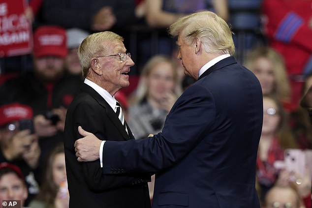President Donald Trump Greets Former Notre Dame Football Coach Lou Holtz At A Campaign Rally At The Allen County War Memorial Coliseum In Fort Wayne, Indiana