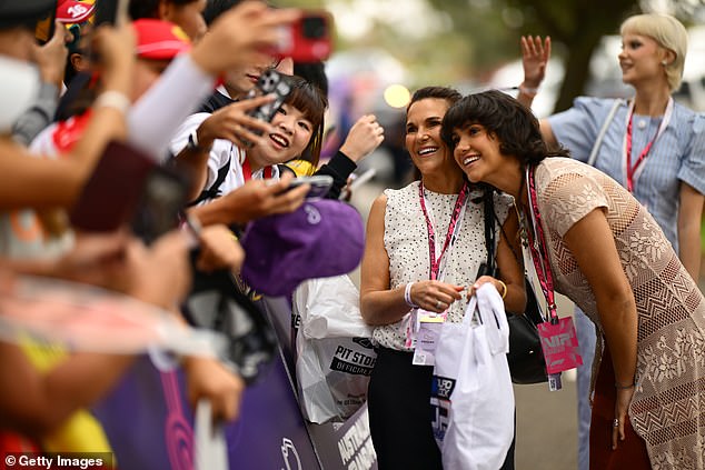 Nicole And Edie Piastri Pose For A Selfie With A Fan On The Melbourne Walk Prior To Practice