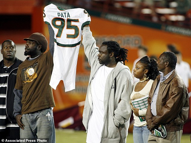 Bryan Pata's Family Holds Up His Jersey At The Beginning Of A College Football Game Back In 2006