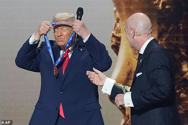 Donald Trump, Pictured Picking Up His Peace Award From Fifa President Gianni Infantino Last December, Insists He 'Does Not Care' If Iran Play At The World Cup